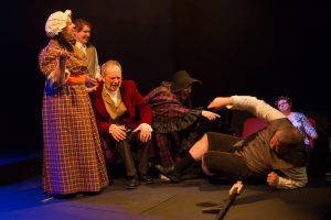 (L to R) DANA MESSINA GALAGAN (Dorothy), TYLER PETTY (Bart), TIM HOBAN (Phil), BRITTANY GRIFFINS (M.J.) and JED SLAUGHTER (Wayne) from the Lakewood Playhouse Production of "INSPECTING CAROL". Photos by Tim Johnston.